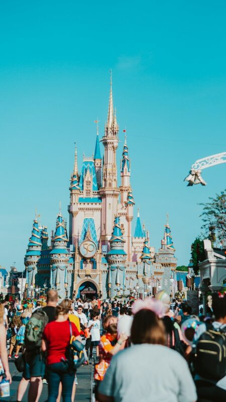 a crowd of people in front of a castle