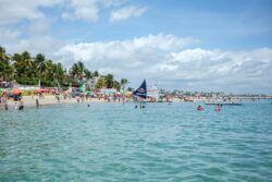 a crowded beach with many people on it